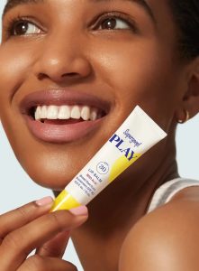 supergoop-play-lip-balm-spf-30-with-acai-model-with-pack